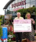 Colin Squire presenting the cheque to Linda Petrons of Greenfingers Charity.